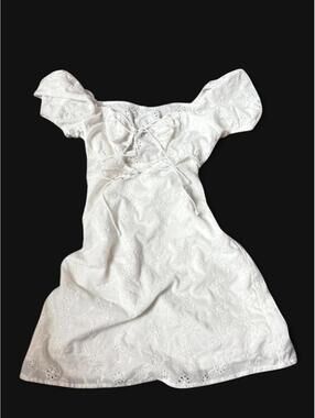 White eyelet mini dress with puffy sleeves and tie up front (double lined)